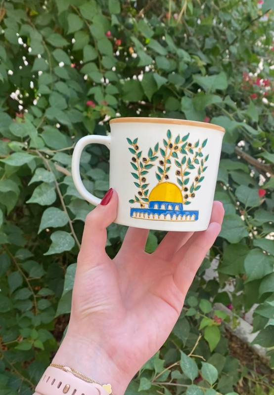 A Glass mug featuring a design inspired by the Dome of the Rock